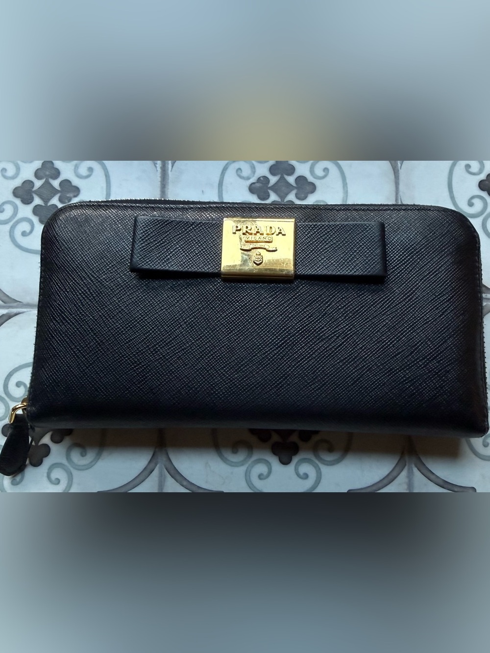 Prada Black Saffiano Leather Wallet with Gold-Bronze Tone Plaque and Bow